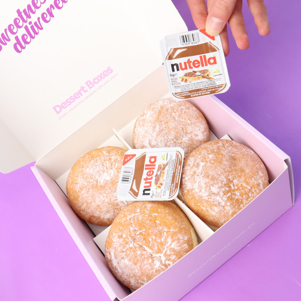 Box of donuts with Nutella packaging on a purple background