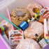 Nutella donuts and Nutella spreads with colourful party poppers in a box
