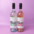 Two bottles of Bremerton wine, one white and one rosé, on a pink background