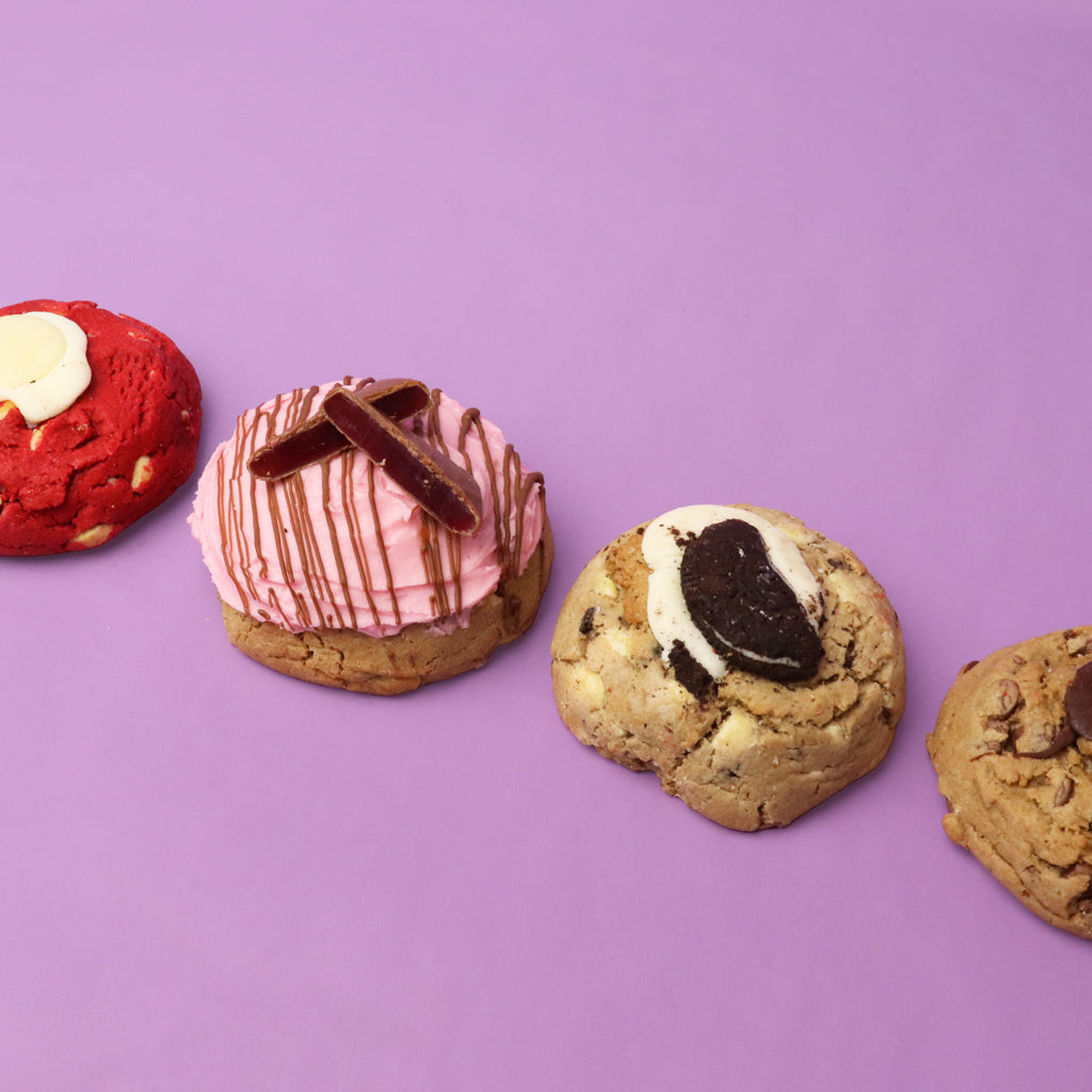 Assorted cookies with different flavors on a purple background